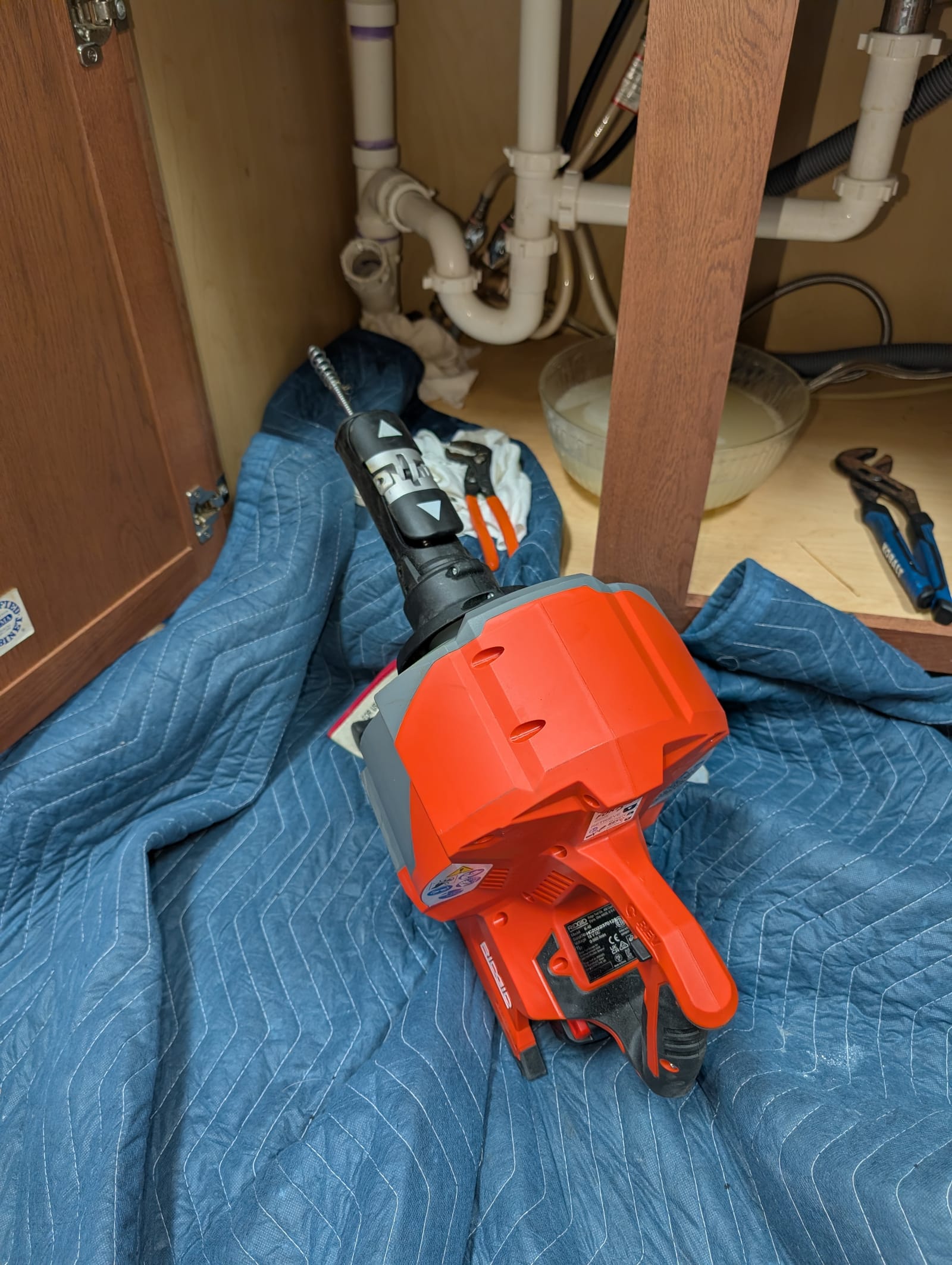 Professional drain cleaning with snake tool
